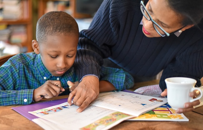 Mother pointing at book